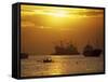 Cargo Ships and Outrigger Canoe in Manila Bay at Sunset, in the Philippines, Southeast Asia-Robert Francis-Framed Stretched Canvas