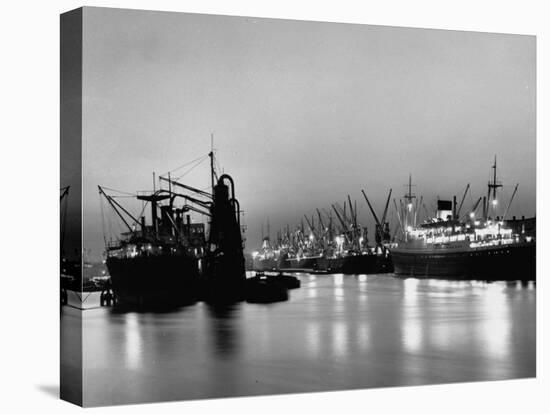 Cargo Ships in the Harbor-Dmitri Kessel-Stretched Canvas