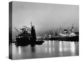 Cargo Ships in the Harbor-Dmitri Kessel-Stretched Canvas