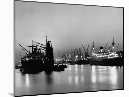 Cargo Ships in the Harbor-Dmitri Kessel-Mounted Photographic Print