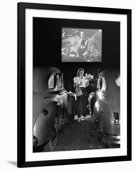 Carhop Carries Tray of Food and Drinks to Car Occupants at Drive-in Movie-Allan Grant-Framed Photographic Print