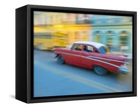 Caribbean, Cuba, Havana, Havana Vieja, UNESCO World Heritage Site, classic car in motion-Merrill Images-Framed Stretched Canvas