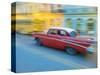 Caribbean, Cuba, Havana, Havana Vieja, UNESCO World Heritage Site, classic car in motion-Merrill Images-Stretched Canvas