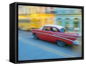 Caribbean, Cuba, Havana, Havana Vieja, UNESCO World Heritage Site, classic car in motion-Merrill Images-Framed Stretched Canvas