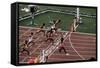 Carl Lewis Crosses the Finishing Line at the Los Angeles Olympics-null-Framed Stretched Canvas