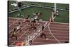 Carl Lewis Crosses the Finishing Line at the Los Angeles Olympics-null-Stretched Canvas