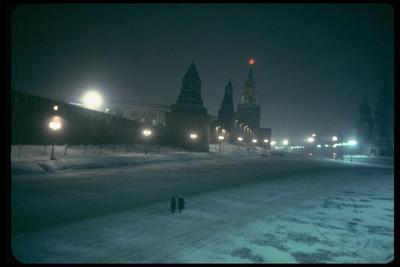 Red Star Atop Kremlin Tower Glowing Against Night-Dim Sky in Snow-Covered, Wintry Moscow, Ussr