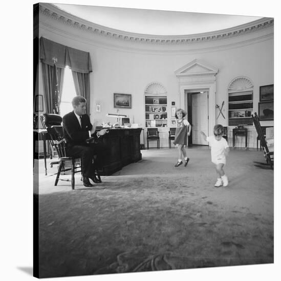 Caroline and John Jr. Dance in the Oval Office as President Kennedy Claps. 1962-null-Stretched Canvas