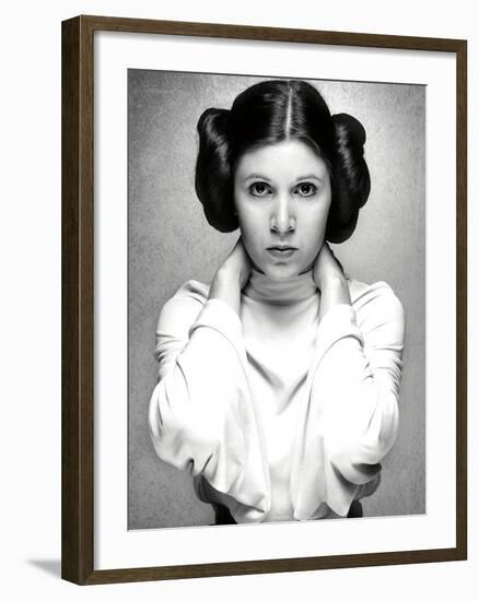 CARRIE FISHER. "Star Wars: Episode IV-A New Hope" [1977], directed by GEORGE LUCAS.-null-Framed Photographic Print