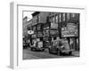 Cars Parked in Front of Four Navy Uniform Stores on Sand Street-Andreas Feininger-Framed Photographic Print