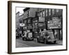 Cars Parked in Front of Four Navy Uniform Stores on Sand Street-Andreas Feininger-Framed Photographic Print