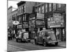 Cars Parked in Front of Four Navy Uniform Stores on Sand Street-Andreas Feininger-Mounted Photographic Print