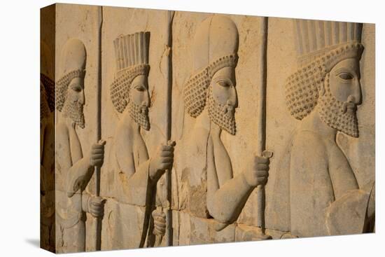 Carved relief of Royal Persian Guards, Apadana Palace, Persepolis, UNESCO World Heritage Site, Iran-James Strachan-Stretched Canvas