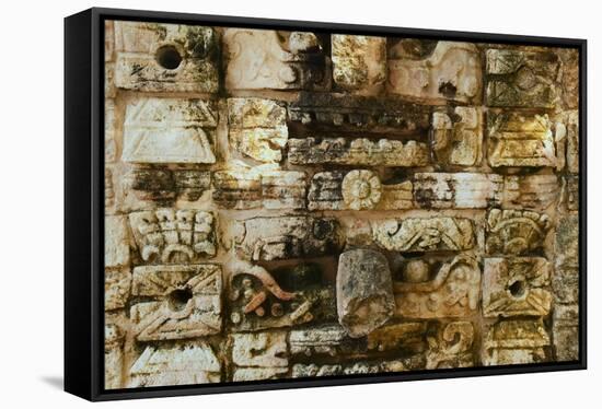 Carved stonework on the Temple of the Warriors at the ancient Mayan city of Chichen Itza, in Yuc...-null-Framed Stretched Canvas