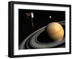 Cassini Spacecraft Orbiting Saturn and And its Moon Titan-null-Framed Art Print