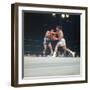 Cassius Clay, aka Muhammad Ali Throwing Famous "Phantom Punch"-George Silk-Framed Premium Photographic Print