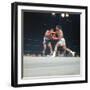 Cassius Clay, aka Muhammad Ali Throwing Famous "Phantom Punch"-George Silk-Framed Premium Photographic Print