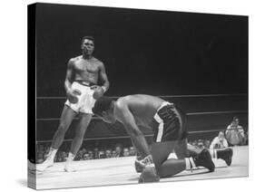 Cassius Clay Dancing Around Ring, Looking at Floyd Patterson, Whom He Has Just Knocked Down-Art Rickerby-Stretched Canvas
