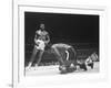 Cassius Clay Dancing Around Ring, Looking at Floyd Patterson, Whom He Has Just Knocked Down-Art Rickerby-Framed Premium Photographic Print