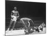 Cassius Clay Dancing Around Ring, Looking at Floyd Patterson, Whom He Has Just Knocked Down-Art Rickerby-Mounted Premium Photographic Print