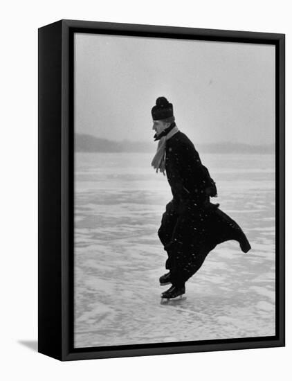 Catholic Priest Ice Skating. from Photo Essay Re Polish American Community-John Dominis-Framed Stretched Canvas