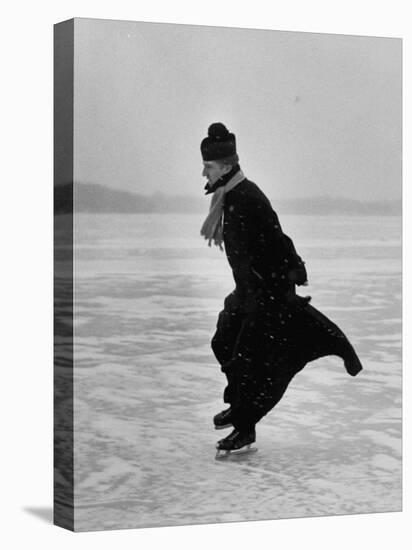 Catholic Priest Ice Skating. from Photo Essay Re Polish American Community-John Dominis-Stretched Canvas