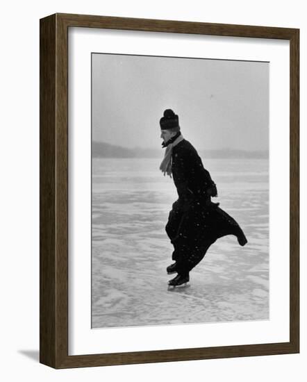 Catholic Priest Ice Skating. from Photo Essay Re Polish American Community-John Dominis-Framed Photographic Print