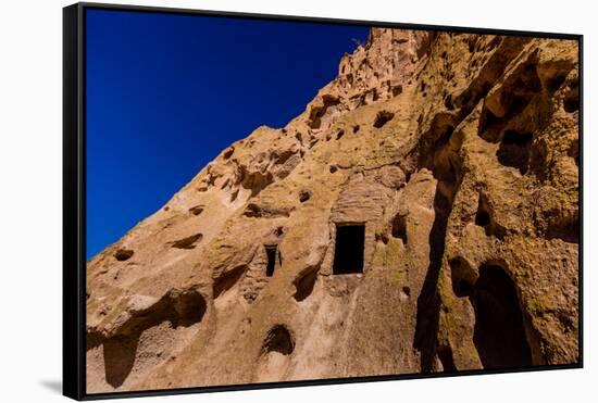 Cave dwellings on the Cliffside of Pueblo Indian Ruins in Bandelier National Monument, USA-Laura Grier-Framed Stretched Canvas