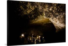 Cavers shining lamps on bats in Pokhara Bat Caves, Pokhara, Nepal, Asia-Laura Grier-Stretched Canvas