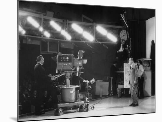 CBS Cameraman Filming Ed Sullivan During "The Ed Sullivan Show," Cue Cards are Visible Behind Him-Arthur Schatz-Mounted Premium Photographic Print