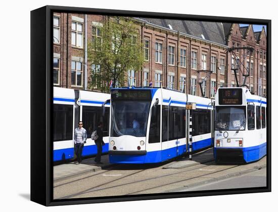 Centraal Station and Trams, Amsterdam, Netherlands, Europe-Amanda Hall-Framed Stretched Canvas