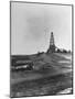 Century Oil Co. Sitting in Field Where Horses and People Mill About Tiny Lone House Sits in Fore.-null-Mounted Photographic Print