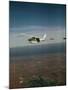 Cessna 210 Centurion Flying-null-Mounted Photographic Print