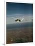 Cessna 210 Centurion Flying-null-Framed Photographic Print
