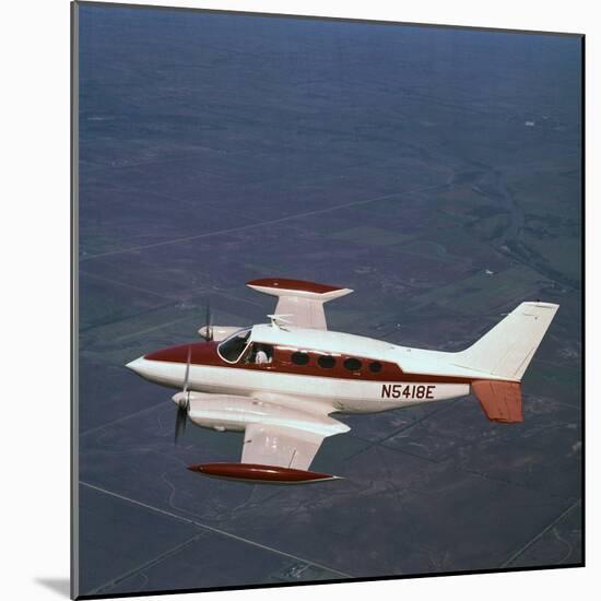 Cessna Airplane Flying-null-Mounted Photographic Print