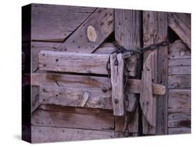 Chains and Lock on Weathered Barn Door-Mick Roessler-Stretched Canvas