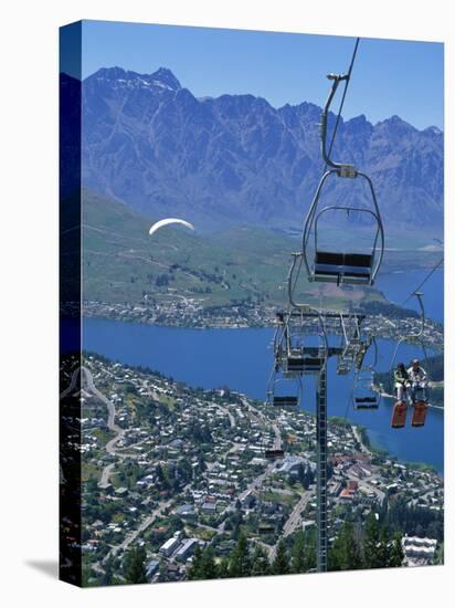 Chair Lift with Lake Wakatipu, the Remarkable Mountains and Queenstown, South Island, New Zealand-Jeremy Bright-Stretched Canvas