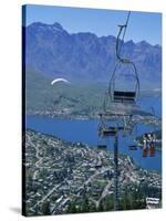 Chair Lift with Lake Wakatipu, the Remarkable Mountains and Queenstown, South Island, New Zealand-Jeremy Bright-Stretched Canvas