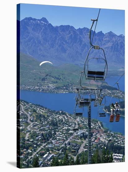 Chair Lift with Lake Wakatipu, the Remarkable Mountains and Queenstown, South Island, New Zealand-Jeremy Bright-Stretched Canvas