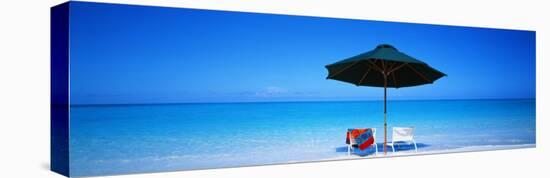 Chairs under an Umbrella on the Beach, Turks and Caicos Islands, North Atlantic Ocean-null-Stretched Canvas