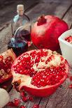 Pomegranate, Juice in Glass, Mortar and Pestle on Wooden Table-ChamilleWhite-Photographic Print
