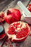 Pomegranate, Juice in Glass, Mortar and Pestle on Wooden Table-ChamilleWhite-Photographic Print