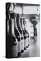 Champagne Bottles in a Row-Walter Bibikow-Stretched Canvas