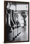 Champagne Bottles in a Row-Walter Bibikow-Framed Premium Photographic Print