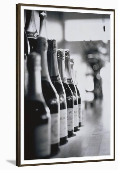 Champagne Bottles in a Row-Walter Bibikow-Framed Premium Photographic Print