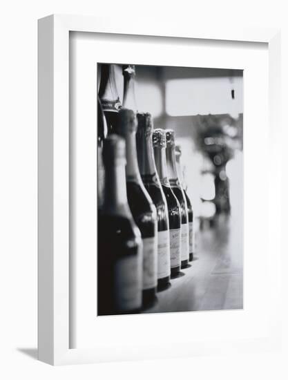 Champagne Bottles in a Row-Walter Bibikow-Framed Photographic Print