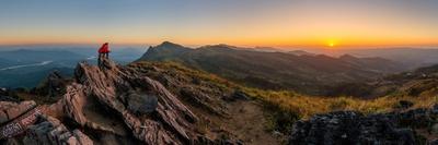 Panoramic View of a Man Watching Sunset in the Most Beautiful Time-Chan Srithaweeporn-Framed Photographic Print