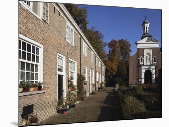 Chapel and Brick Housing Within the Courtyard of the Begijnhof (Beguinage) in Breda, Noord-Brabant,-Stuart Forster-Mounted Photographic Print