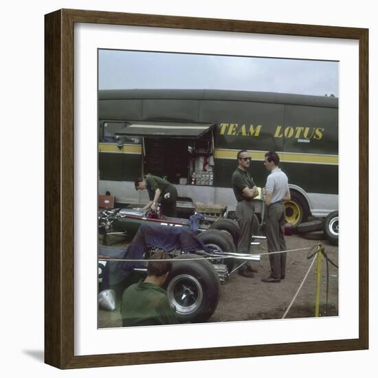 Chapman and Clark Outside the Lotus Team Bus, French Grand Prix, Clermont-Ferrand, France, 1965-null-Framed Photographic Print