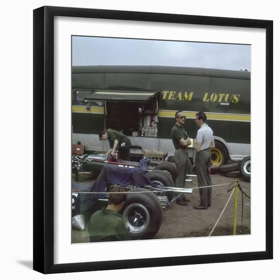 Chapman and Clark Outside the Lotus Team Bus, French Grand Prix, Clermont-Ferrand, France, 1965-null-Framed Photographic Print